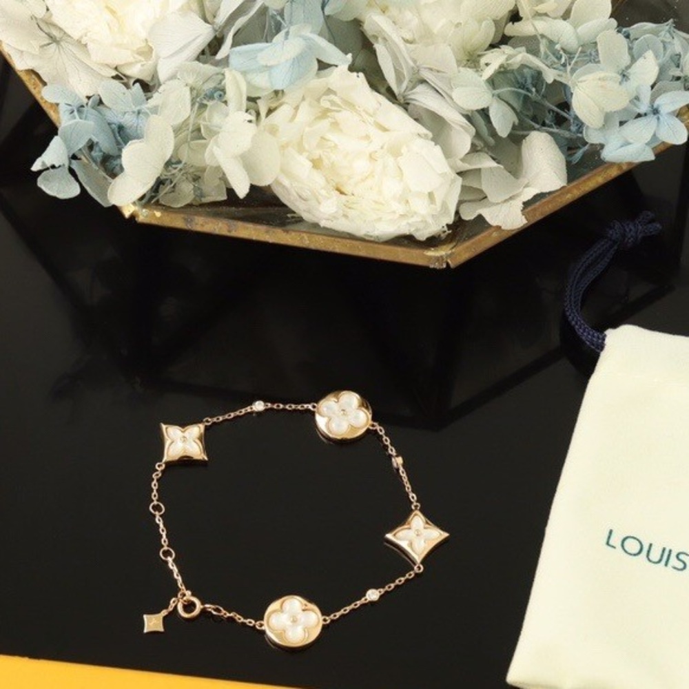 Women's Louis Vuitton Gold Bracelet with Cream Floral Charms